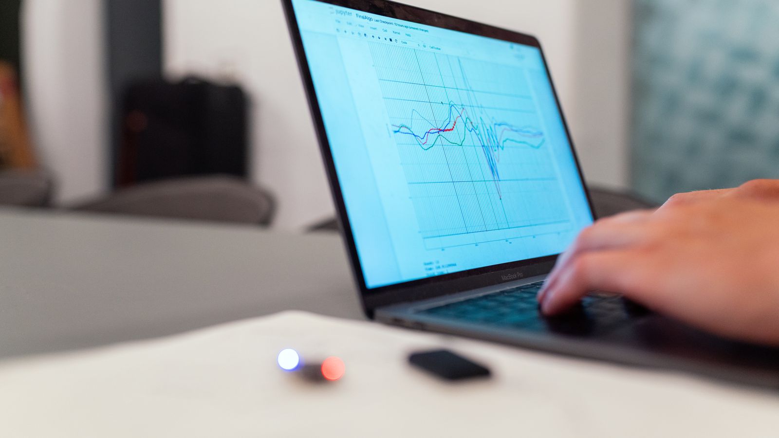Laptop displaying data analytics charts