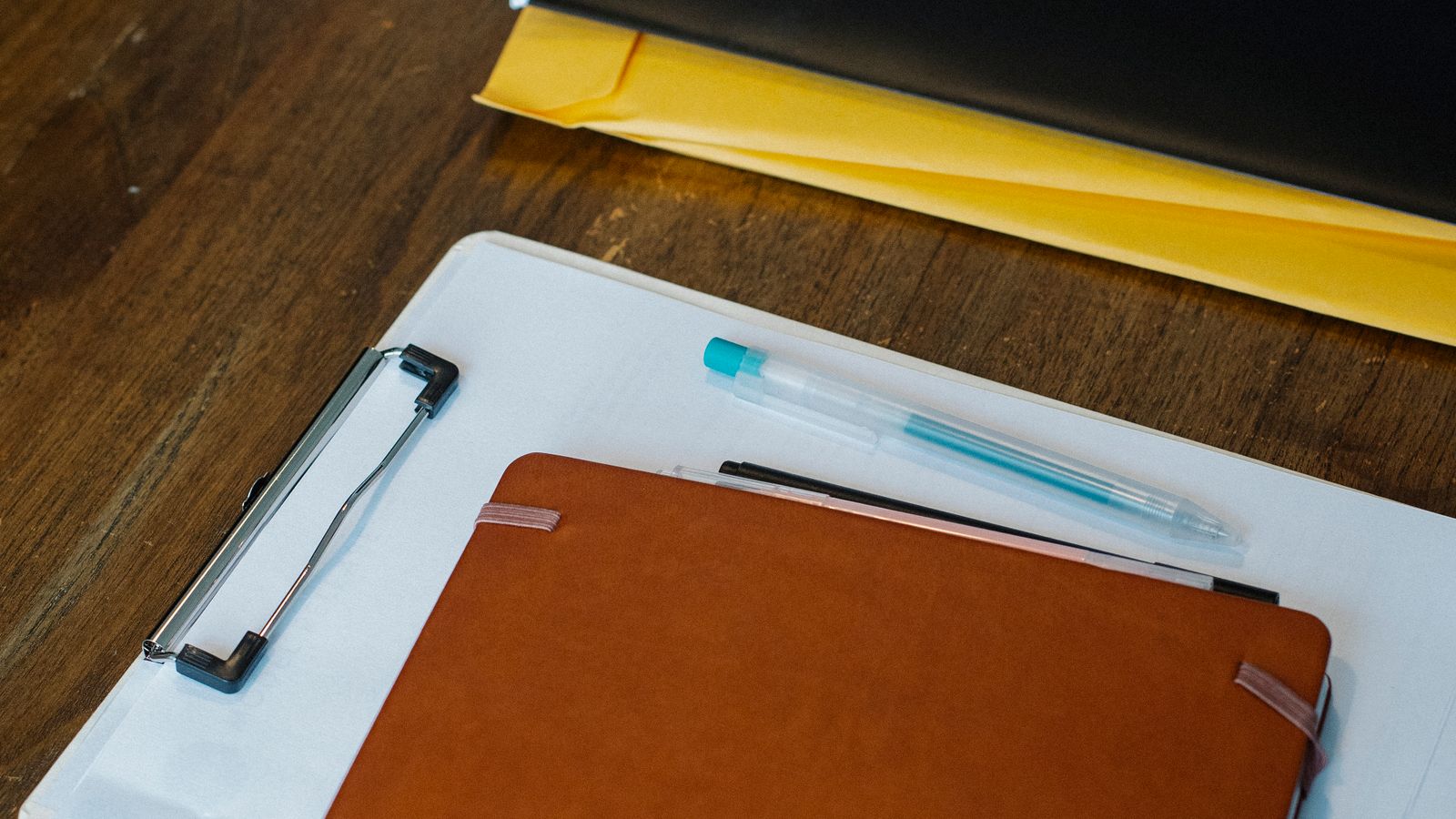 Clipboard and notebook on a desk for planning